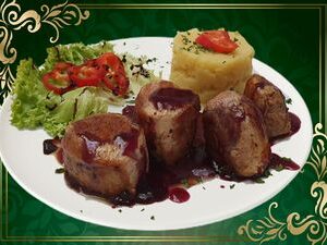Mușchiuleț de porc în sos  de vin  200 gr.